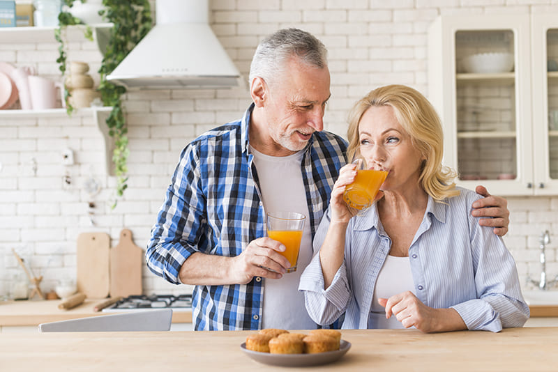 A graphic illustrating orange-themed oral health along with vision, hearing, prostate health, and weight loss insights.