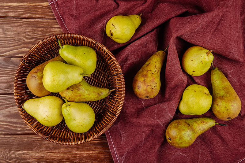 Fresh pears symbolizing health benefits for oral, vision, hearing, prostate health, and weight loss