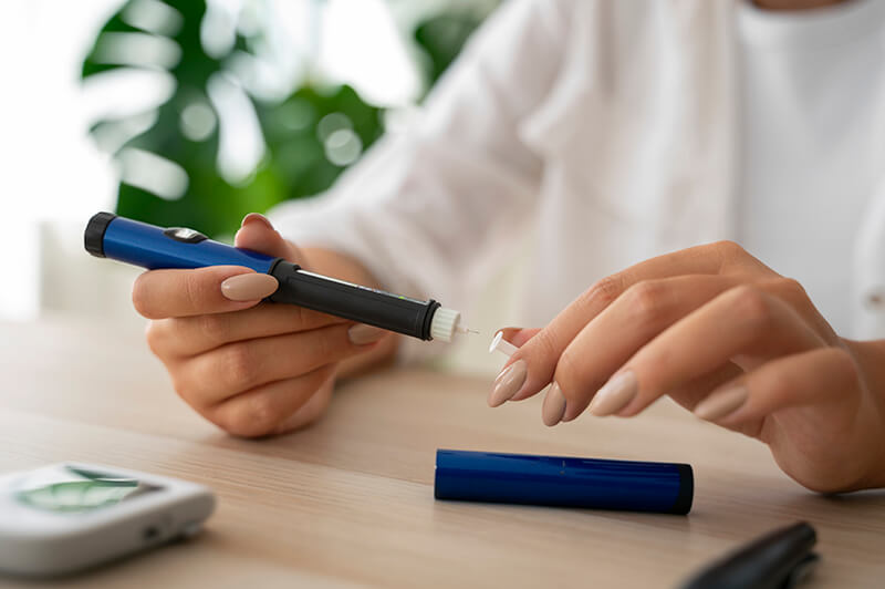 A diabetic woman measuring her glucose level